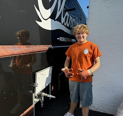 Sixth-generation Eddinger family member Zachary sports a pumpkin spice propane T-shirt, and the store gives away hats, shirts and stickers as promotional items. 