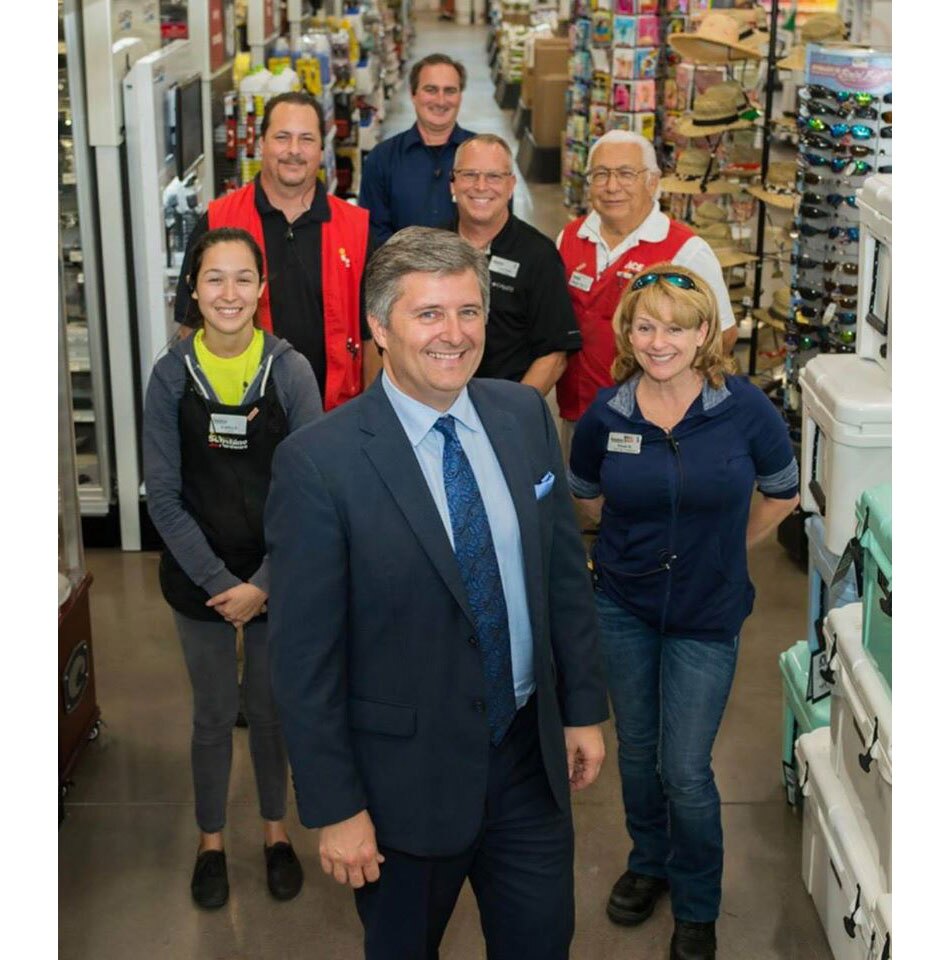 Michael Wynn, president of Sunshine Ace Hardware, is in front. Behind him l to r: Kaitlyn Pena, Mike Karp, Dan Granville, Scott Puch, Ray Chapa and Wendy King.