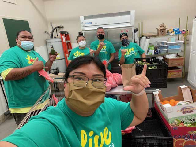 HPM Building Supply owner-employees pack meals at the Hawaii Food Basket as part of the 100 Acts of Service initiative to commemorate the company’s centennial anniversary this year.
