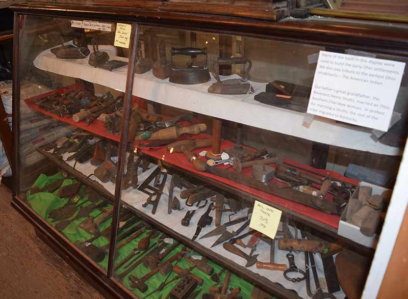 Many of the tools in this display were used to build the early Ohio settlements. In paying tribute to Ohio’s earliest inhabitants—the American Indian—a sign notes that the current owners’ great-grandfather, Reverend Henry Shutts, married an Ohio Southern Cherokee woman. In protest for marrying a Shutts, the rest of the tribe migrated to Kentucky.