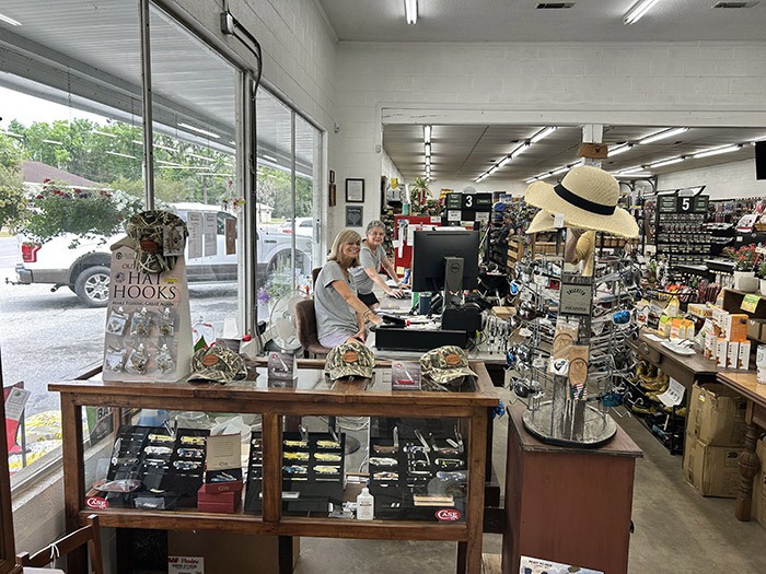Laura and Erika transformed an old NAPA store into Sawgrass Hardware with a hands-on approach, refurbishing Kroger shelving and crafting a checkout counter from a repurposed workbench. Their resourcefulness and personal touch are evident throughout the store.  