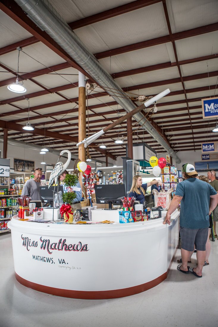 M&M Building Supply’s new checkout counter was built to look like the stern of a deadrise workboat, the type of boat that used to be prevalent in their seafaring community of Mathews, Va.