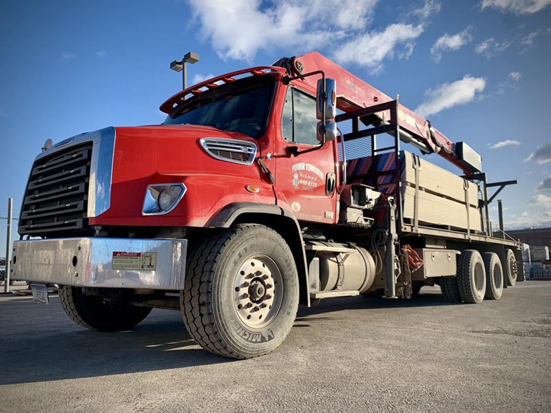 A Power Townsend delivery truck loaded with lumber heads out to a job site of one of the company’s network of about 4,000 active contractor accounts.